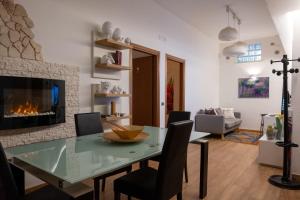 a living room with a table and a fireplace at tulipano rosso in Bari