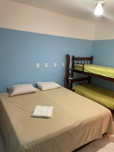 Ένα ή περισσότερα κρεβάτια σε δωμάτιο στο Chapadão Suítes