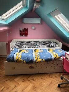 En eller flere senge i et værelse på Stay in maison de metre in Etterbeek