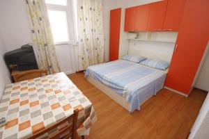 Postel nebo postele na pokoji v ubytování Apartments Lidus