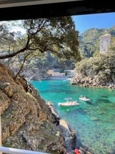 two boats in the water on a river at Casa dell'Arco 31 in Camogli +21 photos