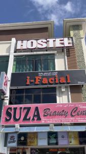a building with a sign for a sula bakery at Suza Hostel in Tumpat