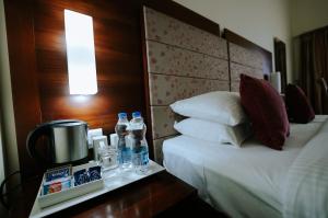 Letto o letti in una camera di Hotel Devaragam by K P Namboodiri's