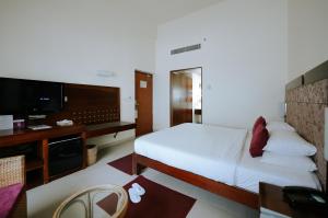 Letto o letti in una camera di Hotel Devaragam by K P Namboodiri's