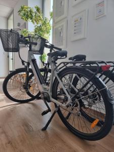 a bike with two baskets is parked in a room at Homeincalpe Borumbot in Calpe