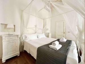 Ένα ή περισσότερα κρεβάτια σε δωμάτιο στο Luxury apartment close to S. Frediano – Victor