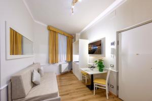 TV a/nebo společenská místnost v ubytování Albergo Reggio