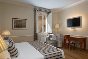 A bed or beds in a room at Albergo Reggio