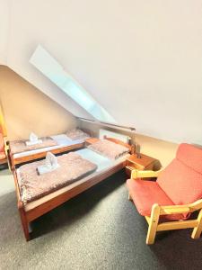 Postel nebo postele na pokoji v ubytování Penzion a restaurace U Nováků