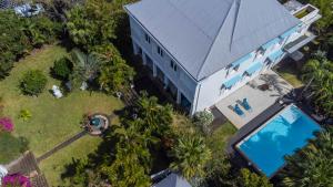 an overhead view of a building with a swimming pool at Villa Myriam in Saint-Pierre