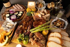 a table topped with lots of different types of food at LACOSTA in Hōden