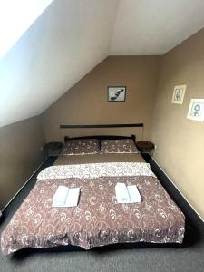 Postel nebo postele na pokoji v ubytování Penzion a restaurace U Nováků