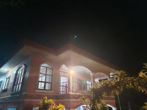 a large house with a balcony on top of it at Rotunda Inn home stay in Pagadian