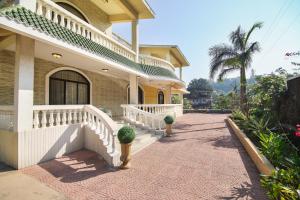 a house with a staircase and a walkway at Akbar Villa 4BHK With Pool in Lonavala
