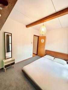 Postel nebo postele na pokoji v ubytování Moment Chalet Hakuba
