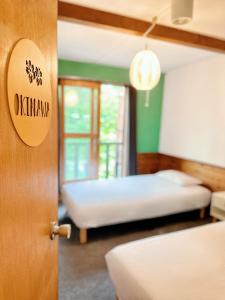 Postel nebo postele na pokoji v ubytování Moment Chalet Hakuba