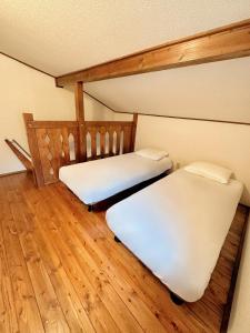 Postel nebo postele na pokoji v ubytování Moment Chalet Hakuba