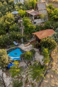 an aerial view of a garden with a swimming pool at Villa Mutaf in Kumluca