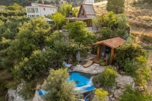 an aerial view of a small house with a pool at Villa Mutaf in Kumluca