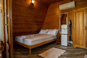 a bedroom with a bed in a wooden room at Villa Mutaf in Kumluca +97 photos