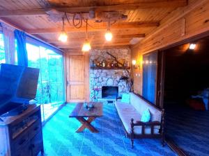 a living room with a couch and a table at Villa Mutaf in Kumluca
