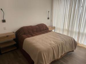 Postel nebo postele na pokoji v ubytování Balcones del Valle Trevelin - Patagonia