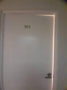 a white door with the number on it at Excelente ubicación San Isidro Suite 11 in Lima