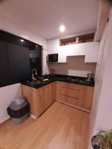 a kitchen with a sink and a counter top at Excelente ubicación San Isidro Suite 11 in Lima