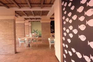a dining room with a table and chairs at Quiet & Cozy Resort Style Fully Furnished 1-BHK Apartment in Dabolim