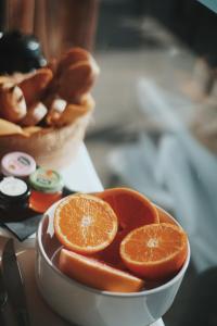 a bowl of orange slices sitting on a table at Palm Beach in Ajaccio