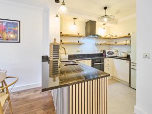 a kitchen with a sink and a counter top at Host & Stay - Bellflower Mews in Canterbury
