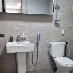 a bathroom with a sink and a toilet and a shower at Stay Colorido in Siheung