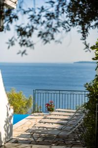 a balcony with a view of the ocean at Four-Bedroom Villa Eleni by Konnect, with Private Pool & Stunning Seaview in Barbati