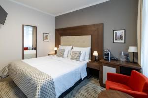 Hotel Ikona客房内的一张或多张床位