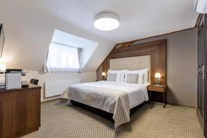 Hotel Ikona客房内的一张或多张床位