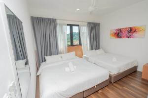 Postel nebo postele na pokoji v ubytování Ipoh Tambun Sunway Onsen Suite 3R2B Maya