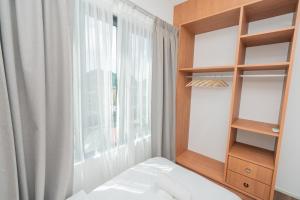 Postel nebo postele na pokoji v ubytování Ipoh Tambun Sunway Onsen Suite 3R2B Maya