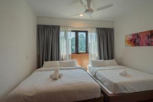Postel nebo postele na pokoji v ubytování Ipoh Tambun Sunway Onsen Suite 3R2B Maya