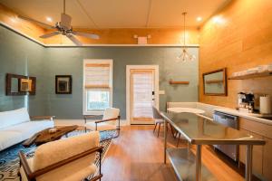 a living room with a couch and a table at Downtown Fairhope Studio in Fairhope