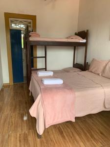 Postel nebo postele na pokoji v ubytování Suítes Casa da Colônia
