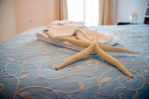 Katil atau katil-katil dalam bilik di Apart Hotel Apolonia Palace
