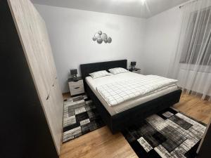 Postel nebo postele na pokoji v ubytování Emanuela Apartaments