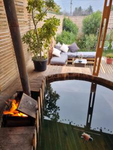 a backyard with a pool and a fire pit at Domos kupellon in Santiago