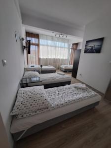 Postel nebo postele na pokoji v ubytování Figaro Apartaments