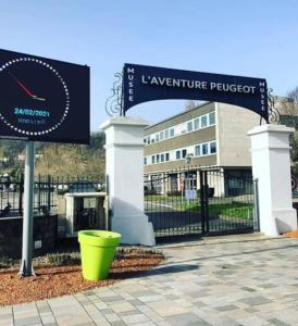 a sign in front of a library with a building at OLOO Habitat - Le19 - Parking Privé in Montbéliard