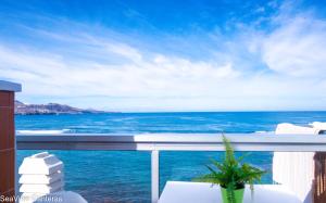 a view of the ocean from a balcony at Seaview Canteras in Las Palmas de Gran Canaria