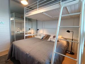 a bedroom with two bunk beds in a room at Syöte Panorama in Syöte