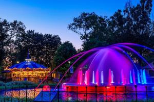 a gazebo with pink and blue lights in a park at Center City Philly Home, Cozy 1-BR, Ideal Location for 4 Guests! in Philadelphia