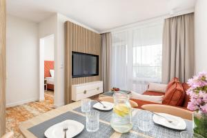 A television and/or entertainment centre at Rent like home - Bel Mare F324