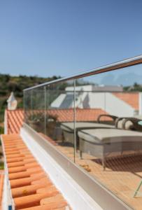 a view of the roof of a house at Casa Pedro in Salema - Oceanview & beach in Salema